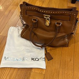 Large Michael Kors bag. Brown with gold details. Gently used.